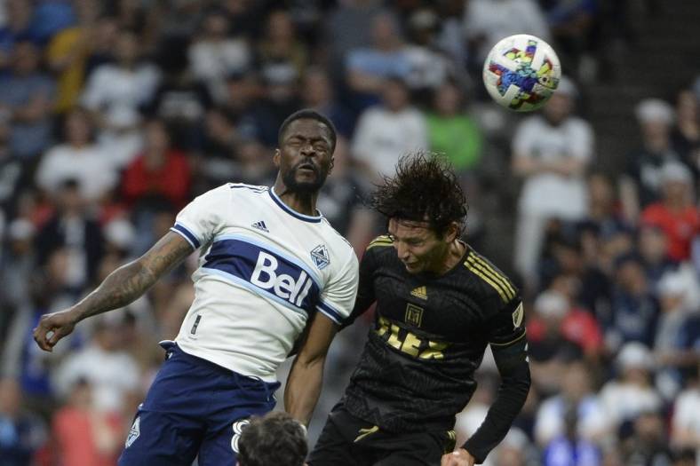 Jul 2, 2022; Vancouver, British Columbia, CAN;  Vancouver Whitecaps forward Tosaint Ricketts (87) goes up for a header against Los Angeles FC midfielder Ilie Sanchez (6) during the second half at BC Place. Mandatory Credit: Anne-Marie Sorvin-USA TODAY Sports