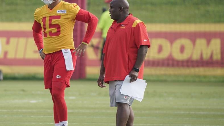 Jul 27, 2022; St. Joseph, MO, USA; Kansas City Chiefs quarterback Patrick Mahomes (15) talks with offensive coordinator Eric Bieniemy during training camp at Missouri Western State University. Mandatory Credit: Denny Medley-USA TODAY Sports