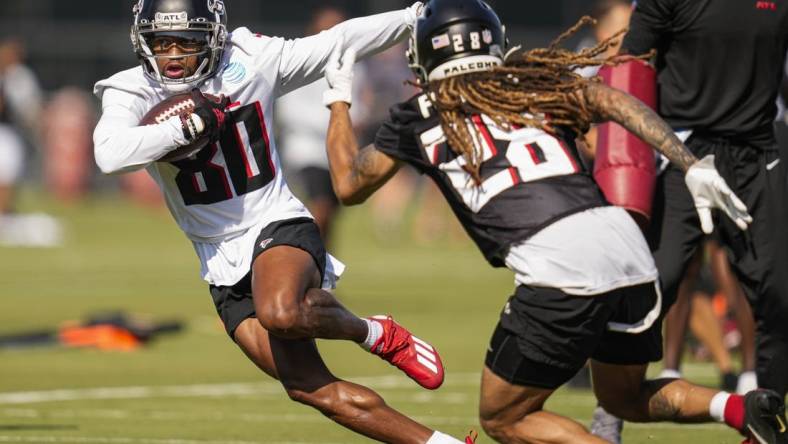 Jul 29, 2022; Flowery Branch, GA, USA; Atlanta Falcons wide receiver Cameron Batson (80) runs against defensive back Mike Ford (28) during training camp at IBM Performance Field. Mandatory Credit: Dale Zanine-USA TODAY Sports