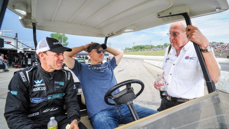 NASCAR champion Matt Kenseth, business manager Adrian Parker and the Rev. Dale Grubba talk on pit road before the ARCA Midwest Tour Gandrud 250 Tuesday, August 2, 2022, at Wisconsin International Raceway in Kaukauna.

Kaukauna