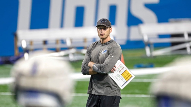 Lions offensive coordinator Ben Johnson watches open practice at Family Fest at Ford Field on Saturday, August 6, 2022.