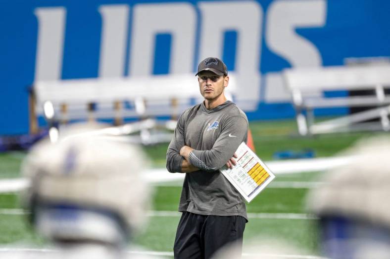 Lions offensive coordinator Ben Johnson watches open practice at Family Fest at Ford Field on Saturday, August 6, 2022.
