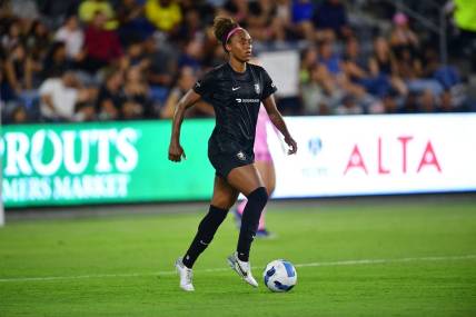 Aug 10, 2022; Los Angeles, CA, USA; Angel City FC defender Allyson Swaby (25) controls the ball against Tigres UANL during the second half of an international friendly at Banc Of California Stadium. Mandatory Credit: Gary A. Vasquez-USA TODAY Sports