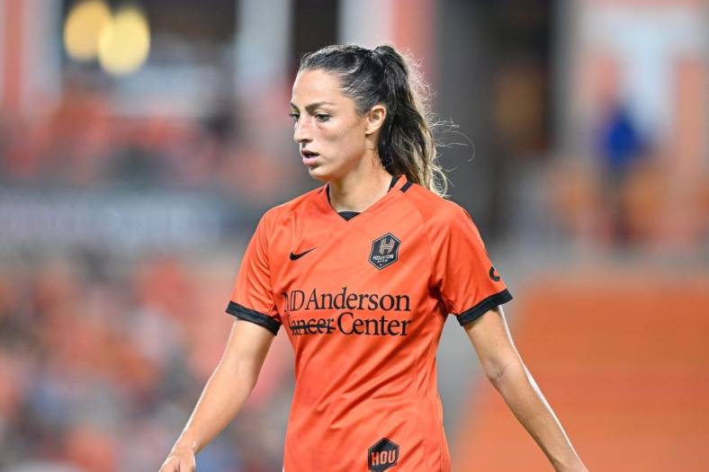 Aug 12, 2022; Houston, Texas, USA; Houston Dash forward Ryan Gareis (21) reacts to a play during the second half against Racing Louisville FC at PNC Stadium. Mandatory Credit: Maria Lysaker-USA TODAY Sports
