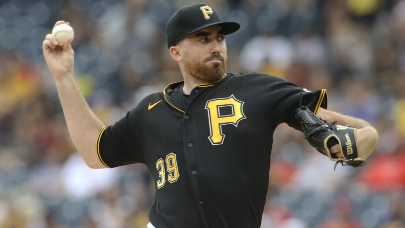 Aug 21, 2022; Pittsburgh, Pennsylvania, USA; Pittsburgh Pirates starting pitcher Zach Thompson (39) delivers a pitch against the Cincinnati Reds during the first inning at PNC Park. Mandatory Credit: Charles LeClaire-USA TODAY Sports