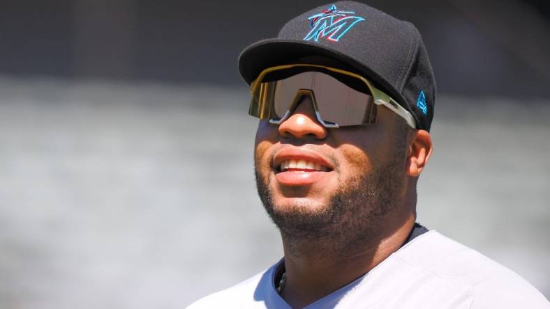 Aug 24, 2022; Oakland, California, USA; Miami Marlins first baseman Jesus Aguilar (99) returns to the dugout after the second inning at RingCentral Coliseum. Mandatory Credit: Kelley L Cox-USA TODAY Sports