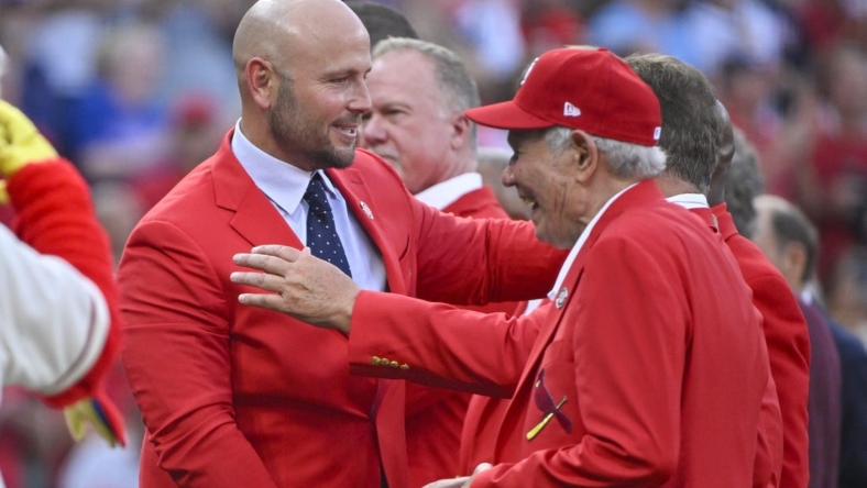 Aug 27, 2022; St. Louis, Missouri, USA;  Former St. Louis Cardinals outfielder Matt Holliday celebrates with members of the Cardinals Red Jacket Club after he was inducted into the Cardinals Hall of Fame before a game against the Atlanta Braves at Busch Stadium. Mandatory Credit: Jeff Curry-USA TODAY Sports