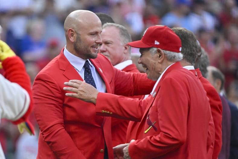 Aug 27, 2022; St. Louis, Missouri, USA;  Former St. Louis Cardinals outfielder Matt Holliday celebrates with members of the Cardinals Red Jacket Club after he was inducted into the Cardinals Hall of Fame before a game against the Atlanta Braves at Busch Stadium. Mandatory Credit: Jeff Curry-USA TODAY Sports