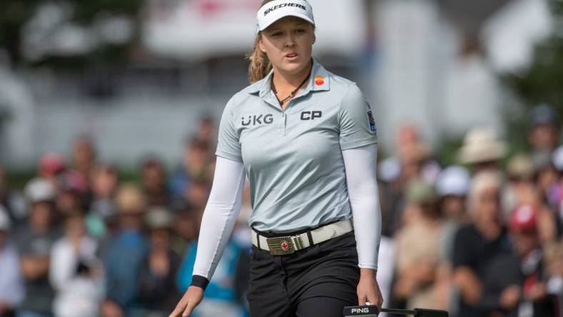 Aug 27, 2022; Ottawa, Ontario, CAN; Brooke Henderson from Canada follows the ball after a putt on the green of the 1st hole during the third round of the CP Women's Open golf tournament. Mandatory Credit: Marc DesRosiers-USA TODAY Sports