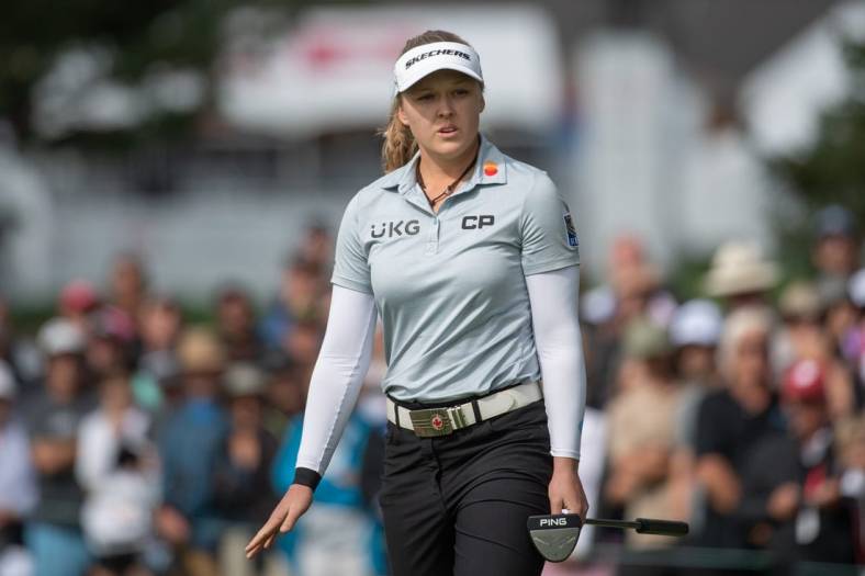 Aug 27, 2022; Ottawa, Ontario, CAN; Brooke Henderson from Canada follows the ball after a putt on the green of the 1st hole during the third round of the CP Women's Open golf tournament. Mandatory Credit: Marc DesRosiers-USA TODAY Sports