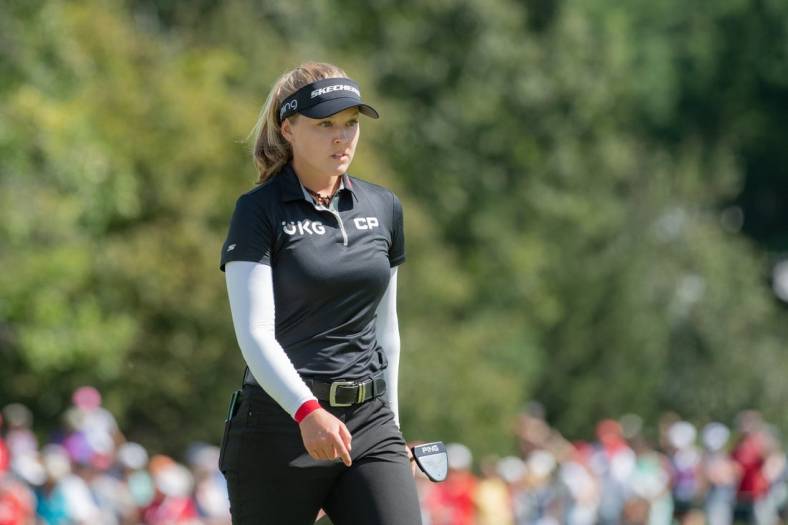 Aug 28, 2022; Ottawa, Ontario, CAN; Brooke Henderson from Canada  walks on the 18th hole green during the final round of the CP Women's Open golf tournament. Mandatory Credit: Marc DesRosiers-USA TODAY Sports