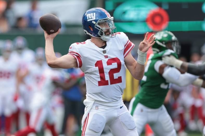 Aug 28, 2022; East Rutherford, New Jersey, USA; New York Giants quarterback Davis Webb (12) throws the ball against the New York Jets during the second half at MetLife Stadium. Mandatory Credit: Vincent Carchietta-USA TODAY Sports