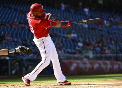 Sep 1, 2022; Washington, District of Columbia, USA; Washington Nationals designated hitter Nelson Cruz (23) singles against the Oakland Athletics during the first inning at Nationals Park. Mandatory Credit: Brad Mills-USA TODAY Sports