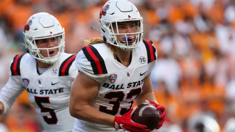 Sep 1, 2022; Knoxville, Tennessee, USA; Ball State Cardinals running back Carson Steele (33) runs with the ball against the Tennessee Volunteers during the first half at Neyland Stadium. Mandatory Credit: Randy Sartin-USA TODAY Sports