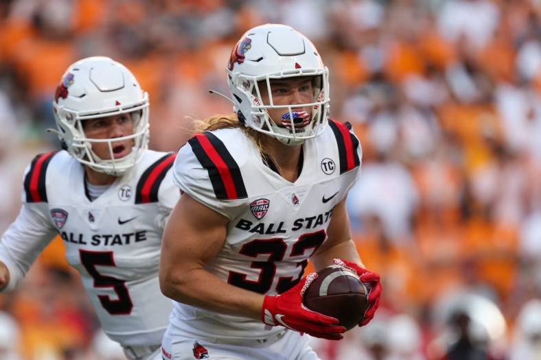 Sep 1, 2022; Knoxville, Tennessee, USA; Ball State Cardinals running back Carson Steele (33) runs with the ball against the Tennessee Volunteers during the first half at Neyland Stadium. Mandatory Credit: Randy Sartin-USA TODAY Sports