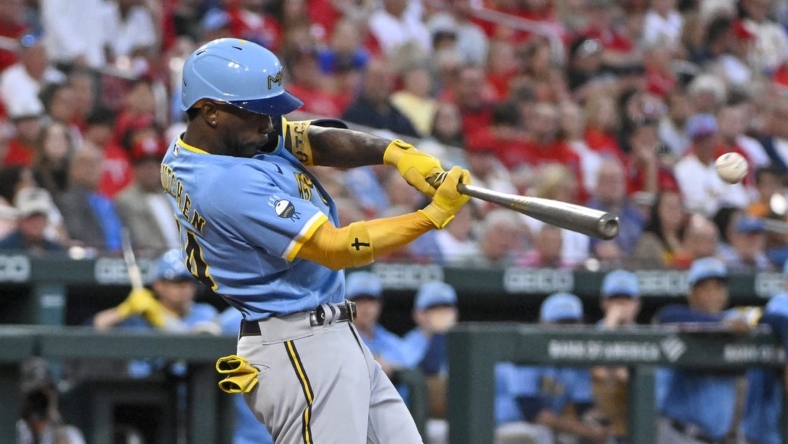 Sep 13, 2022; St. Louis, Missouri, USA;  Milwaukee Brewers designated hitter Andrew McCutchen (24) hits a one run double against the St. Louis Cardinals during the first inning at Busch Stadium. Mandatory Credit: Jeff Curry-USA TODAY Sports