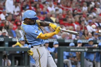 Sep 13, 2022; St. Louis, Missouri, USA;  Milwaukee Brewers designated hitter Andrew McCutchen (24) hits a one run double against the St. Louis Cardinals during the first inning at Busch Stadium. Mandatory Credit: Jeff Curry-USA TODAY Sports