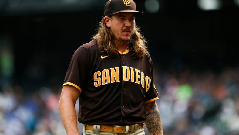 Sep 14, 2022; Seattle, Washington, USA;  San Diego Padres starting pitcher Mike Clevinger (52) walks off the field after throwing against the Seattle Mariners during the first inning at T-Mobile Park. Mandatory Credit: Lindsey Wasson-USA TODAY Sports