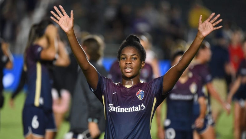 Sep 14, 2022; Cary, North Carolina, USA; North Carolina Courage midfielder Brianna Pinto (5) waves to fans after a match against the Angel City FC at WakeMed Soccer Park. Mandatory Credit: Rob Kinnan-USA TODAY Sports