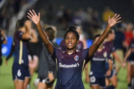 Sep 14, 2022; Cary, North Carolina, USA; North Carolina Courage midfielder Brianna Pinto (5) waves to fans after a match against the Angel City FC at WakeMed Soccer Park. Mandatory Credit: Rob Kinnan-USA TODAY Sports