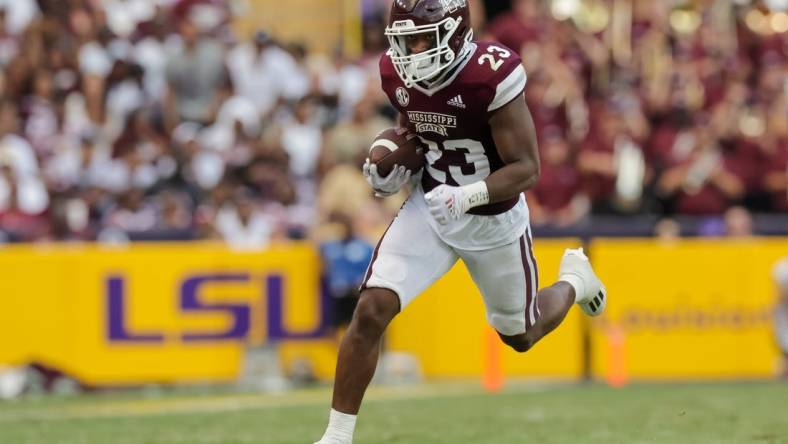 Sep 17, 2022; Baton Rouge, Louisiana, USA;  Mississippi State Bulldogs running back Dillon Johnson (23) rushes against the LSU Tigers during the first half at Tiger Stadium. Mandatory Credit: Stephen Lew-USA TODAY Sports