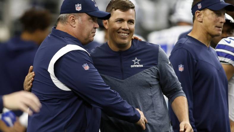 Sep 18, 2022; Arlington, Texas, USA; Dallas Cowboys head coach Mike McCarthy talks to offensive coordinator Kellen Moore before the game against the Cincinnati Bengals  at AT&T Stadium. Mandatory Credit: Tim Heitman-USA TODAY Sports