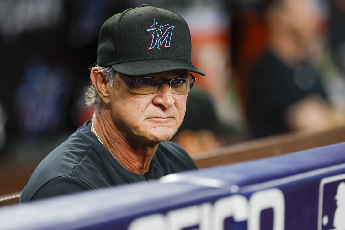 Sep 19, 2022; Miami, Florida, USA; Miami Marlins manager Don Mattingly (8) watches from the dugout during the first inning against the Chicago Cubs at loanDepot Park. Mandatory Credit: Sam Navarro-USA TODAY Sports