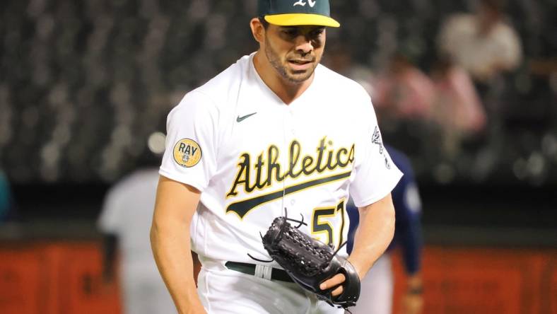 Sep 20, 2022; Oakland, California, USA; Oakland Athletics pitcher Tyler Cyr (57) celebrates after the top of the eighth inning against the Seattle Mariners at RingCentral Coliseum. Mandatory Credit: Kelley L Cox-USA TODAY Sports