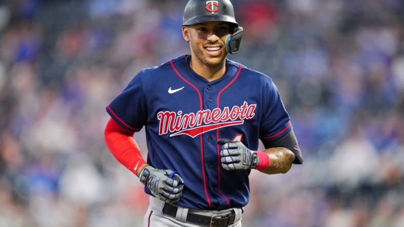 Sep 20, 2022; Kansas City, Missouri, USA; Minnesota Twins shortstop Carlos Correa (4) reacts while running off the field during the first inning against the Kansas City Royals at Kauffman Stadium. Mandatory Credit: Jay Biggerstaff-USA TODAY Sports