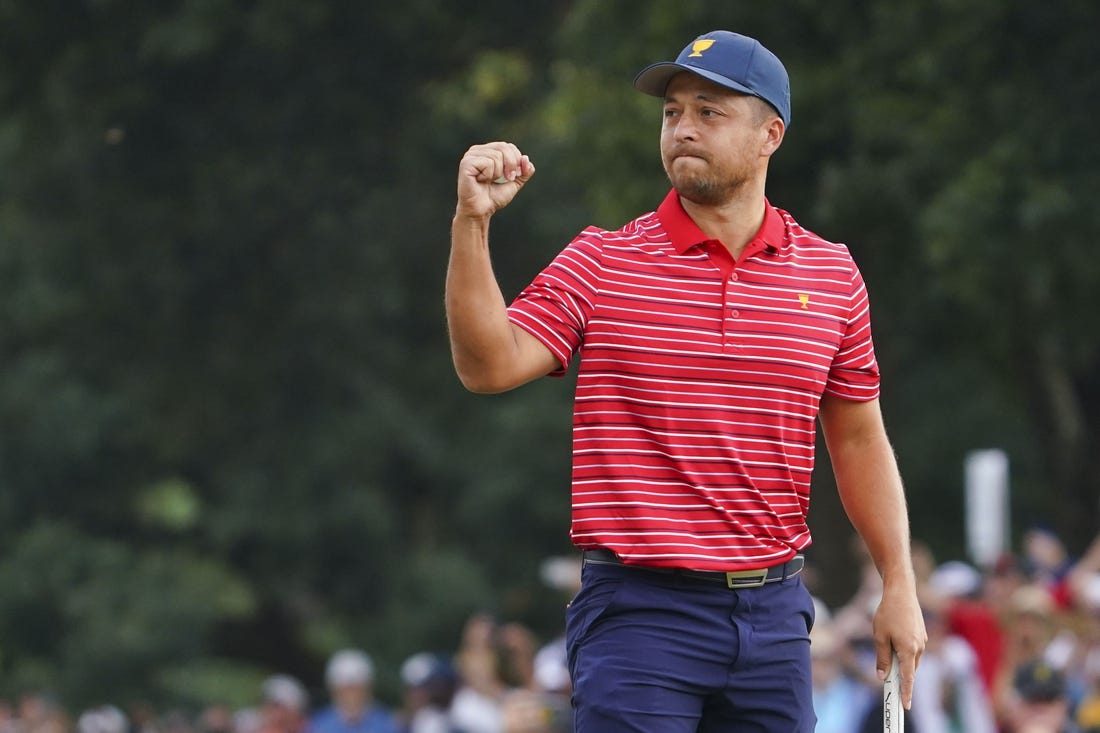 Sep 25, 2022; Charlotte, North Carolina, USA; Team USA golfer Xander Schauffele celebrates clinching the win for Team USA on the 18th green during the singles match play of the Presidents Cup golf tournament at Quail Hollow Club. Mandatory Credit: Peter Casey-USA TODAY Sports