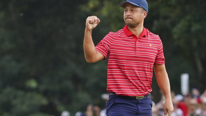 Sep 25, 2022; Charlotte, North Carolina, USA; Team USA golfer Xander Schauffele celebrates clinching the win for Team USA on the 18th green during the singles match play of the Presidents Cup golf tournament at Quail Hollow Club. Mandatory Credit: Peter Casey-USA TODAY Sports