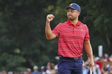 Sep 25, 2022; Charlotte, North Carolina, USA; Team USA golfer Xander Schauffele celebrates clinching the win for Team USA on the 18th green during the singles match play of the Presidents Cup golf tournament at Quail Hollow Club. Mandatory Credit: Peter Casey-USA TODAY Sports