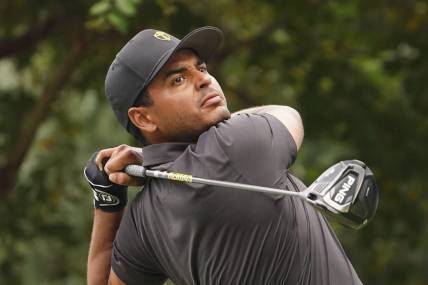 Sep 25, 2022; Charlotte, North Carolina, USA; International Team golfer Sebastian Munoz hits his tee shot on the 17th hole during the singles match play of the Presidents Cup golf tournament at Quail Hollow Club. Mandatory Credit: Peter Casey-USA TODAY Sports