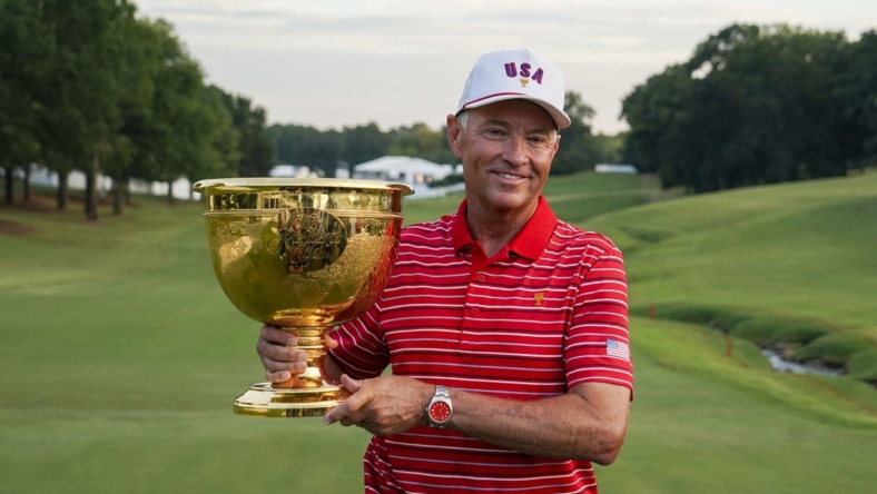 Sep 25, 2022; Charlotte, North Carolina, USA; Team USA captain Davis Love III poses for a photo with the trophy during the singles match play of the Presidents Cup golf tournament at Quail Hollow Club. Mandatory Credit: Peter Casey-USA TODAY Sports