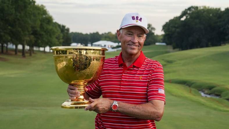 Sep 25, 2022; Charlotte, North Carolina, USA; Team USA captain Davis Love III poses for a photo with the trophy during the singles match play of the Presidents Cup golf tournament at Quail Hollow Club. Mandatory Credit: Peter Casey-USA TODAY Sports