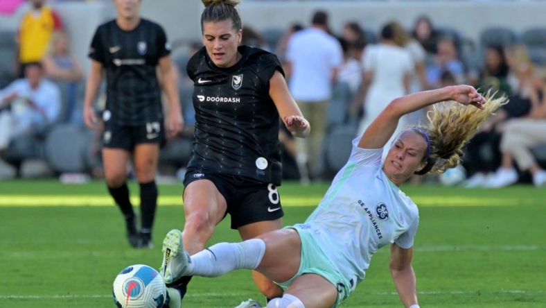 Sep 25, 2022; Los Angeles, California, USA; Racing Louisville FC midfielder Jaelin Howell (6) slide tackles the ball away from Angel City FC midfielder Cari Roccaro (8) during a NWSL game at Banc of California Stadium. Mandatory Credit: Jayne Kamin-Oncea-USA TODAY Sports