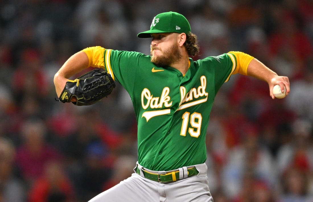 Sep 29, 2022; Anaheim, California, USA;  Oakland Athletics starting pitcher Cole Irvin (19) throws to the plate in the third inning against the Los Angeles Angels at Angel Stadium. Mandatory Credit: Jayne Kamin-Oncea-USA TODAY Sports