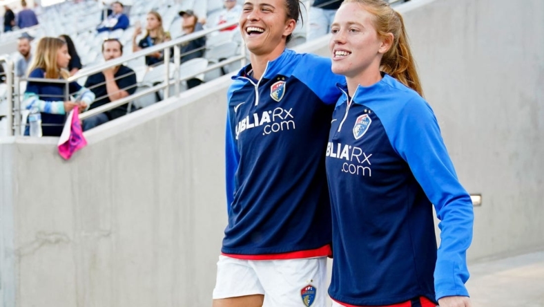 Sep 30, 2022; San Diego, California, USA; North Carolina Courage defender Carson Pickett (left) and midfielder Tess Boade (right) walk to the field before the game against the San Diego Wave FC at Snapdragon Stadium. Mandatory Credit: Ray Acevedo-USA TODAY Sports