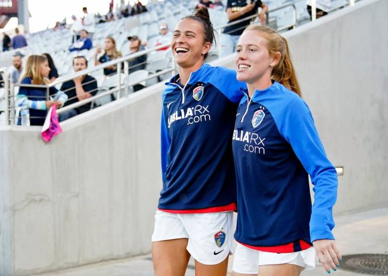Sep 30, 2022; San Diego, California, USA; North Carolina Courage defender Carson Pickett (left) and midfielder Tess Boade (right) walk to the field before the game against the San Diego Wave FC at Snapdragon Stadium. Mandatory Credit: Ray Acevedo-USA TODAY Sports