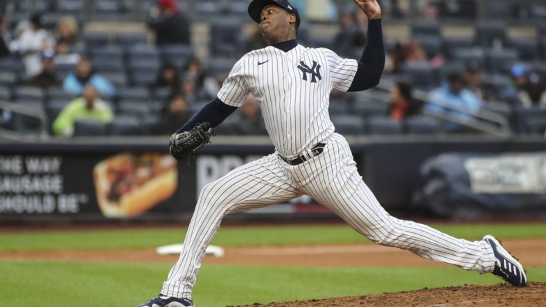 Oct 2, 2022; Bronx, New York, USA;  New York Yankees relief pitcher Aroldis Chapman (54) pitches in the seventh inning against the Baltimore Orioles at Yankee Stadium. Mandatory Credit: Wendell Cruz-USA TODAY Sports