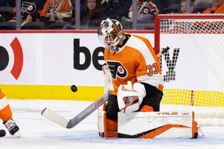 Oct 4, 2022; Philadelphia, Pennsylvania, USA; Philadelphia Flyers goalie Samuel Ersson (33) makes a save against the New York Islanders during the first period at Wells Fargo Center. Mandatory Credit: Bill Streicher-USA TODAY Sports