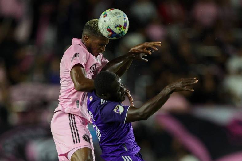 Oct 5, 2022; Fort Lauderdale, Florida, USA;  Inter Miami defender Damion Lowe (31) heads the ball over Orlando City forward Benji Michel (19) in the first half at DRV PNK Stadium. Mandatory Credit: Nathan Ray Seebeck-USA TODAY Sports