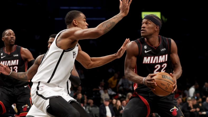 Oct 6, 2022; Brooklyn, New York, USA; Miami Heat forward Jimmy Butler (22) drives to the basket against Brooklyn Nets forward Nic Claxton (33) during the first quarter at Barclays Center. Mandatory Credit: Brad Penner-USA TODAY Sports