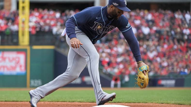 Oct 8, 2022; Cleveland, Ohio, USA; Tampa Bay Rays third baseman Yandy Diaz (2) makes the play against the Cleveland Guardians in the first inning during game two of the Wild Card series for the 2022 MLB Playoffs at Progressive Field. Mandatory Credit: Ken Blaze-USA TODAY Sports