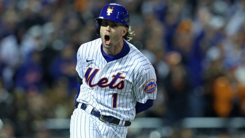 Oct 8, 2022; New York City, New York, USA; New York Mets second baseman Jeff McNeil (1) reacts after hitting a two run double against the San Diego Padres in the seventh inning during game two of the Wild Card series for the 2022 MLB Playoffs at Citi Field. Mandatory Credit: Brad Penner-USA TODAY Sports