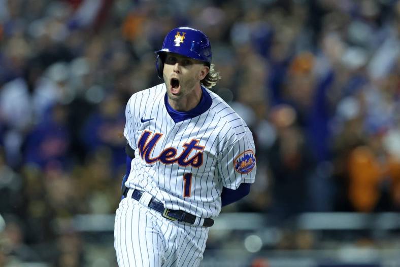 Oct 8, 2022; New York City, New York, USA; New York Mets second baseman Jeff McNeil (1) reacts after hitting a two run double against the San Diego Padres in the seventh inning during game two of the Wild Card series for the 2022 MLB Playoffs at Citi Field. Mandatory Credit: Brad Penner-USA TODAY Sports