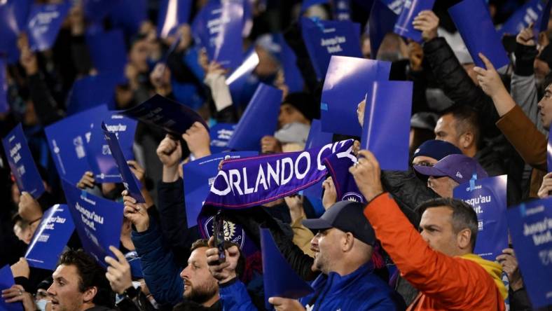 Oct 16, 2022; Montreal, Quebec, Canada; Orlando City fans cheer from the stands during the first half of the match between Orlando City and CF Montreal at Stade Saputo. Mandatory Credit: David Kirouac-USA TODAY Sports