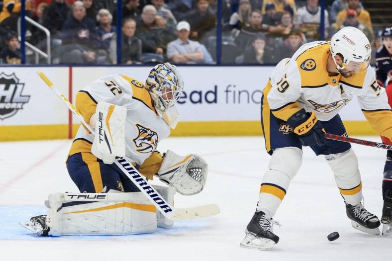Oct 20, 2022; Columbus, Ohio, USA;  Nashville Predators goaltender Kevin Lankinen (32) follows the puck in play in the game against the Columbus Blue Jackets in the second period at Nationwide Arena. Mandatory Credit: Aaron Doster-USA TODAY Sports