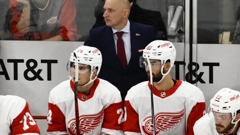 Oct 21, 2022; Chicago, Illinois, USA; Detroit Red Wings coach Derek Lalonde looks on from the bench during the second period against the Chicago Blackhawks at United Center. Mandatory Credit: Matt Marton-USA TODAY Sports