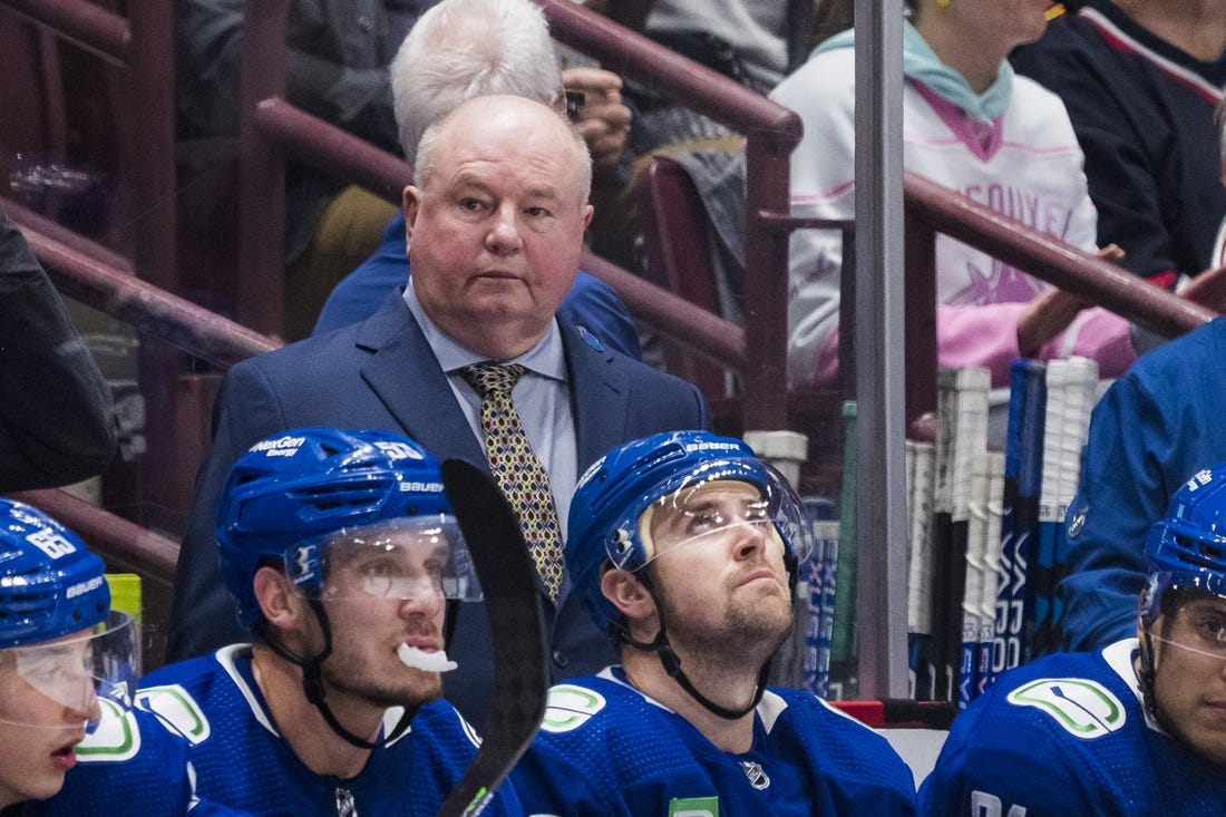 Oct 24, 2022; Vancouver, British Columbia, CAN; Vancouver Canucks head coach Bruce Boudreau on the bench against Carolina Hurricanes in the first period at Rogers Arena. Mandatory Credit: Bob Frid-USA TODAY Sports